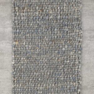 Detailaufnahme eines Haro Teppichs in Naturweiß aus reiner Schurwolle. Die Makroansicht zeigt die präzise Webtechnik ohne Knötchen und das plastische Muster der Hoch-Tief-Struktur, die für eine lebendige, helle Optik sorgt.