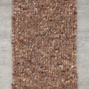 Detailaufnahme eines Haro Teppichs in Naturweiß aus reiner Schurwolle. Die Makroansicht zeigt die präzise Webtechnik ohne Knötchen und das plastische Muster der Hoch-Tief-Struktur, die für eine lebendige, helle Optik sorgt.